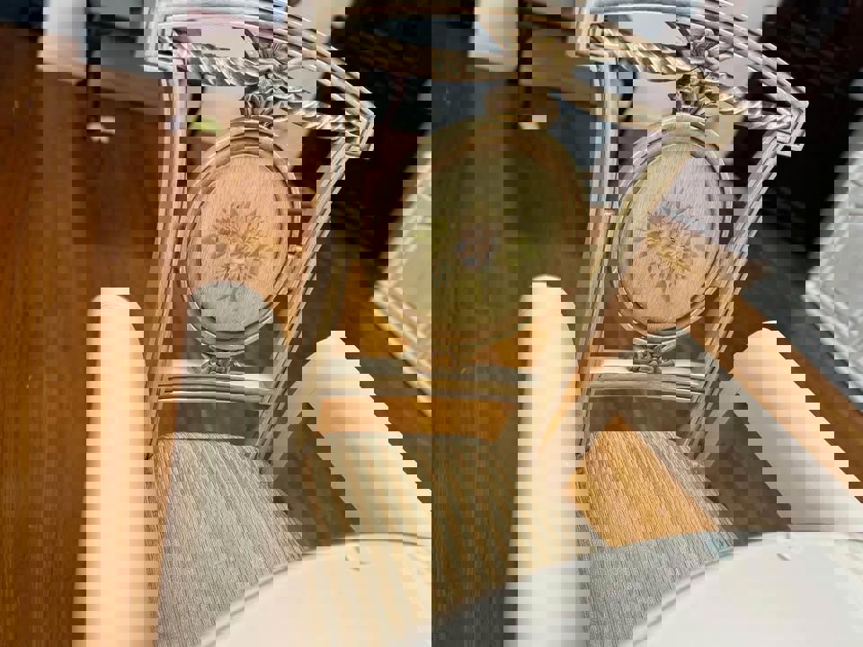 Antique white French dinning table with 6 matching chairs with glass top