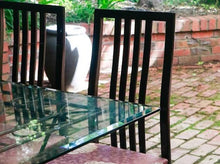 Load image into Gallery viewer, Glass dining table 180x110x76cm with 6 matching refurbished chairs made in Italy
