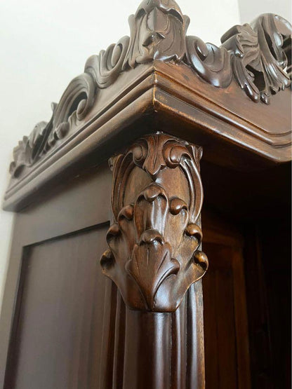 Elegant Vintage Wooden Bookcase with Intricate Carvings